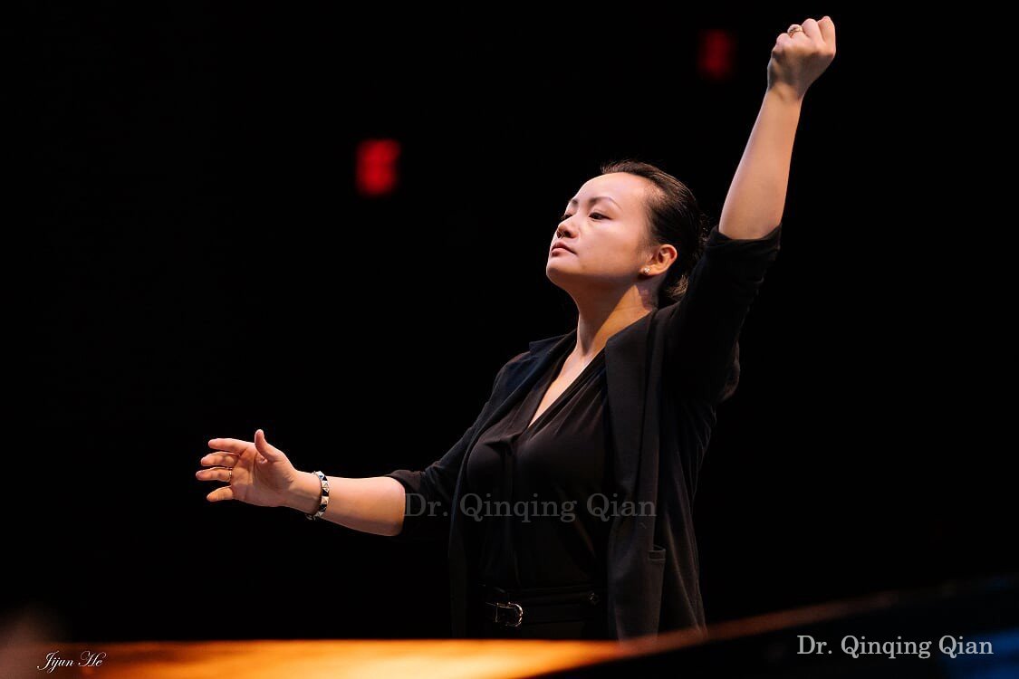 Dr. Qian conducting on the concert stage